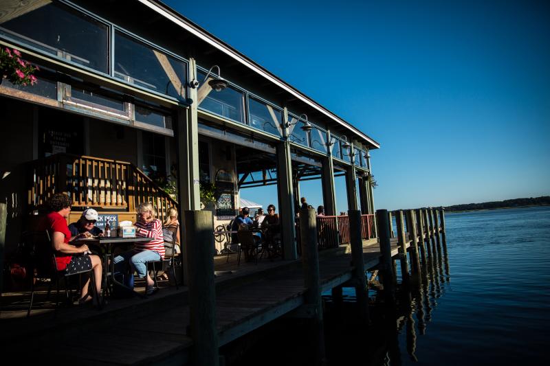 Savor every bite with breathtaking views at The Back Deck, where the waterfront comes to your table.